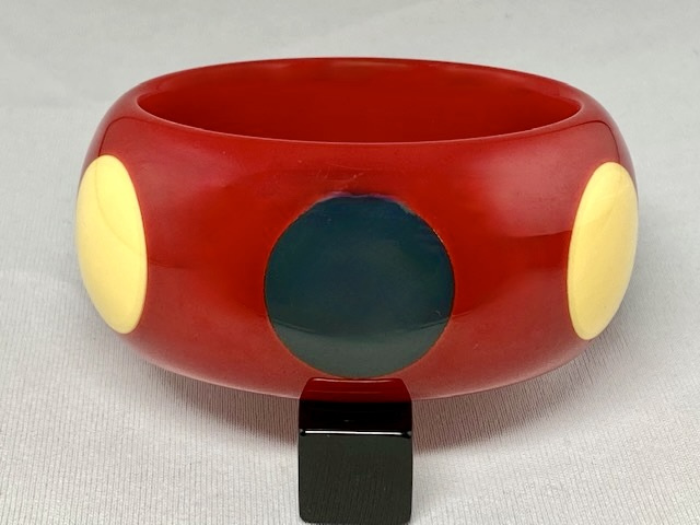 AB126 Pantti wide red Bakelite bangle with cream and blue grey dots