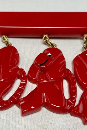 SZ61 Shultz red bakelite see no evil monkeys pin