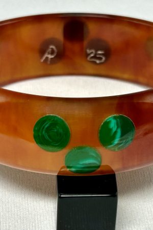 AP16 Marbled tea bakelite bangle with black and 3 shades of green dots