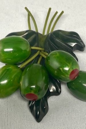 AB128 Moe stuffed olive Bakelite charm pin