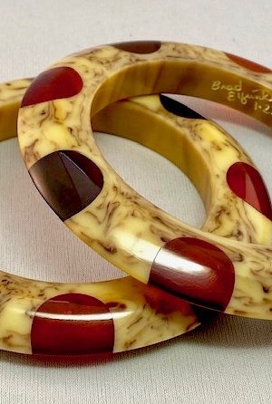 AB130 Elfrink pair saucer bakelite bangles with prystal dots