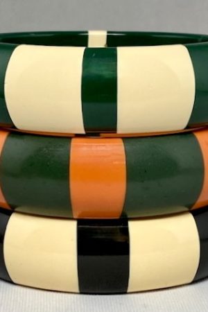 LG220 Best Plastics lucite bangles with laminated cream stripe