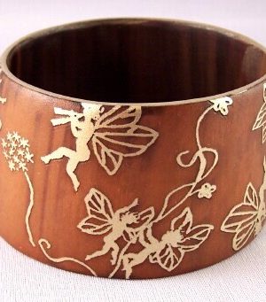PO108 Signed PONO horn bangle w golden fairies